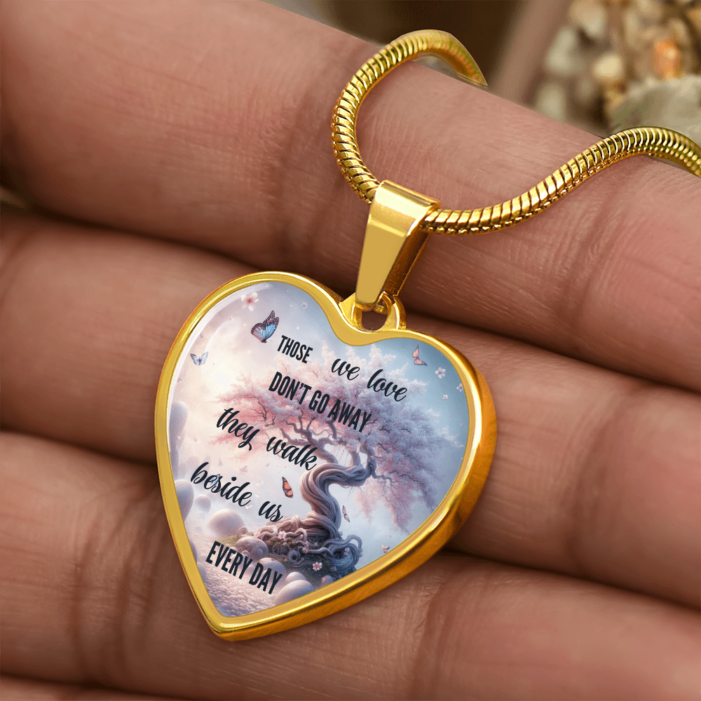 Gold heart-shaped pendant necklace with angel design and inscription "Those we love don't go away they reside beside us.