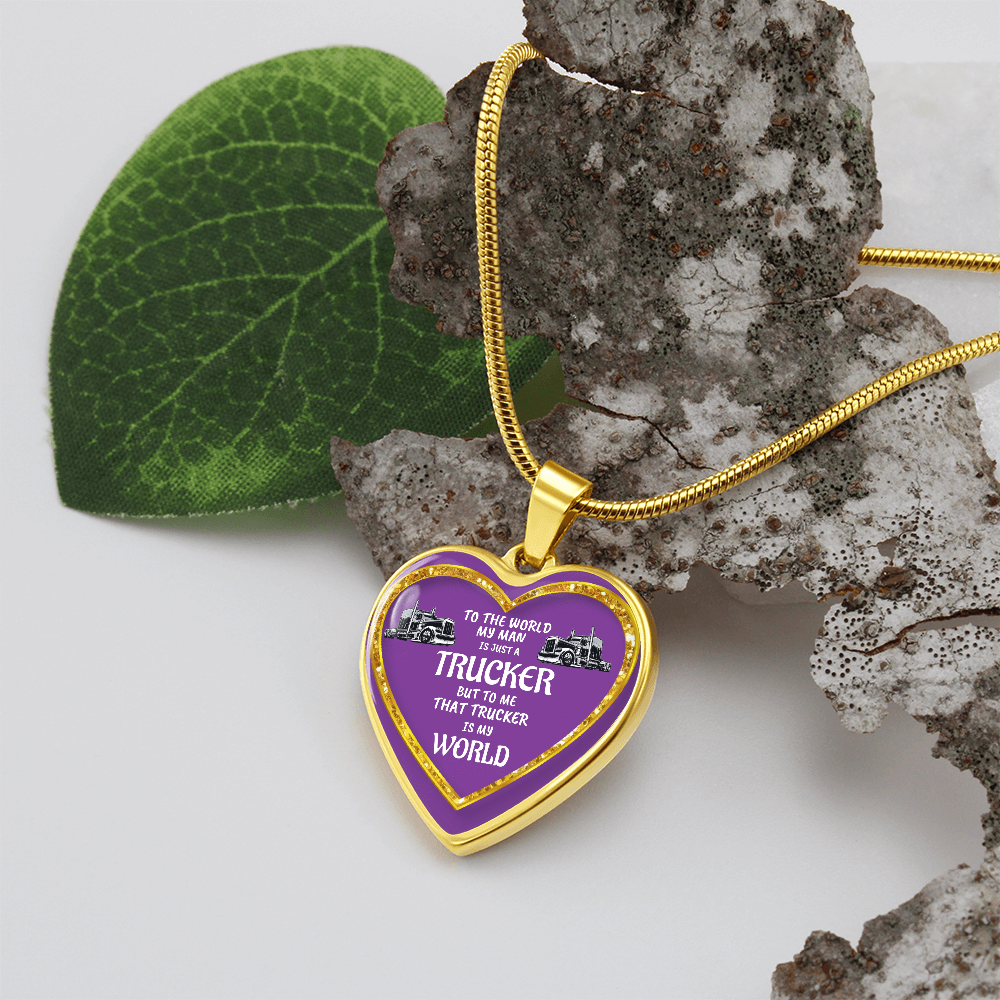 Heart-shaped gold necklace with a purple center and "trucker" text.