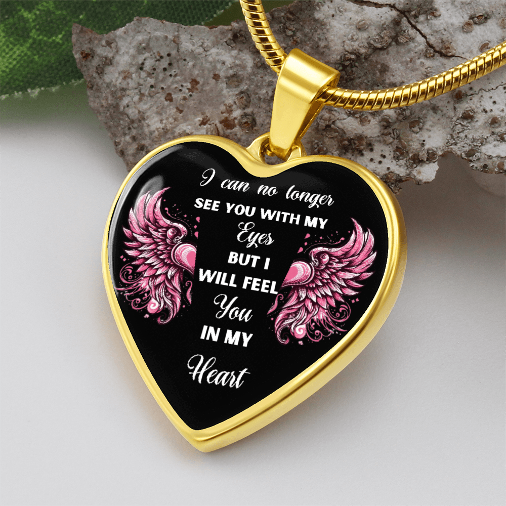 Gold heart pendant necklace with black center and pink angel wings, engraved sentimental message.