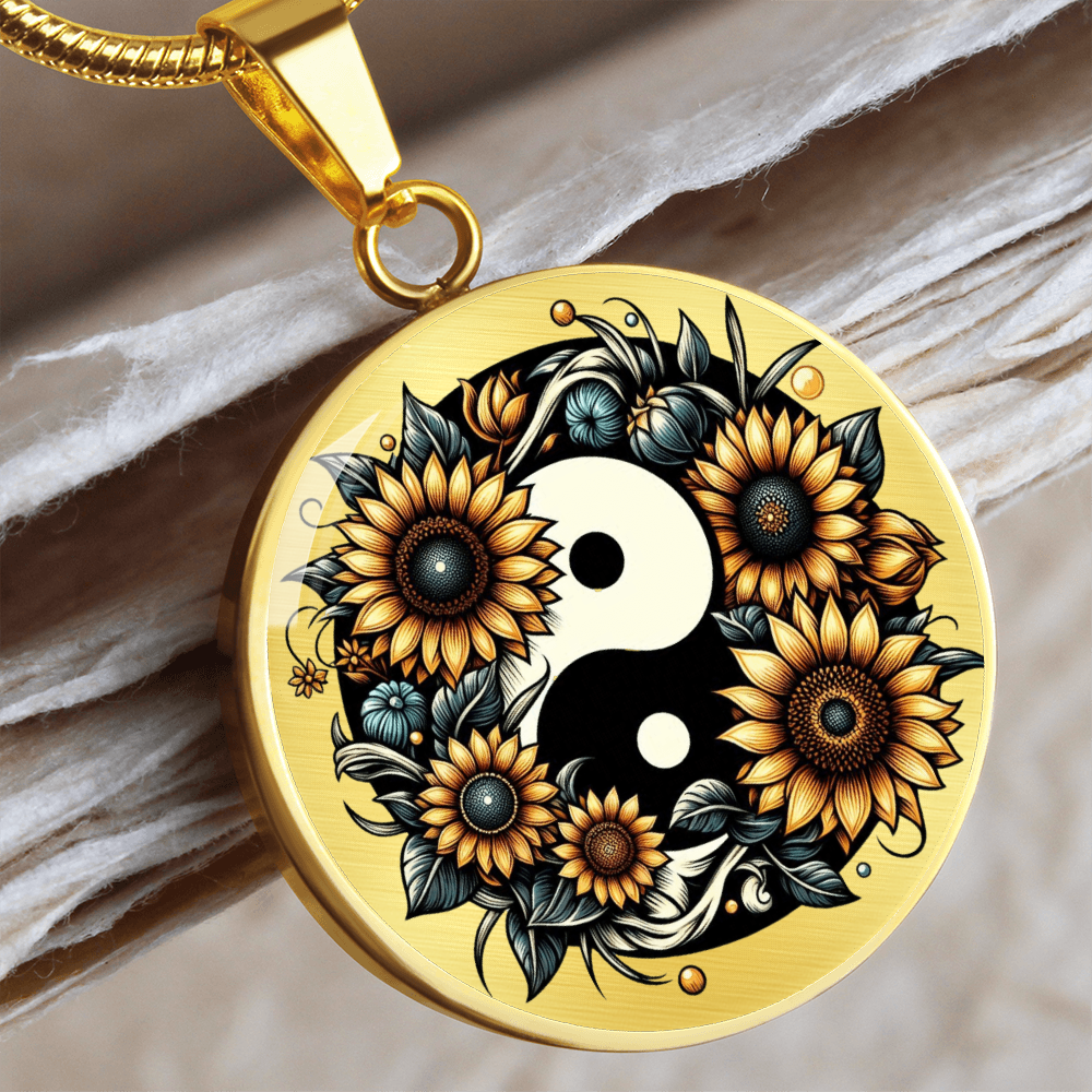 Gold circle pendant necklace with sunflowers and black-and-white yin yang symbol design.