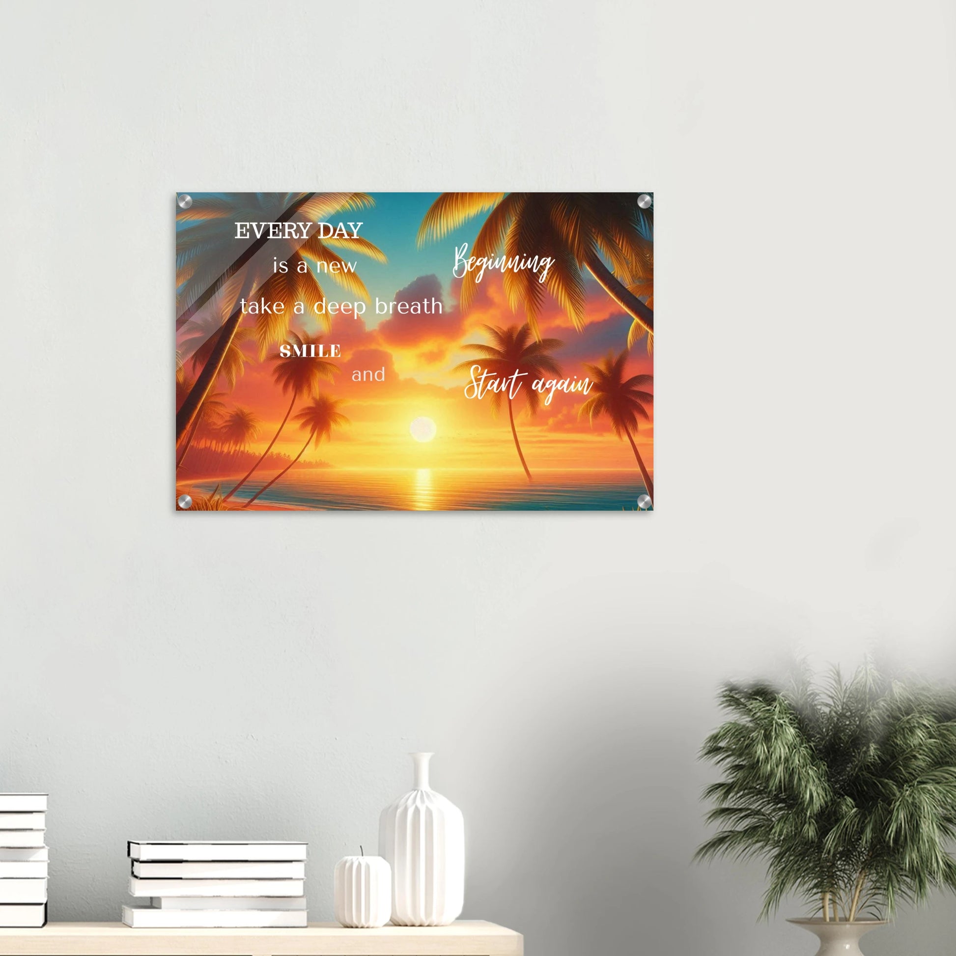 Decorative wall art with sunset and palm trees on a white wall.