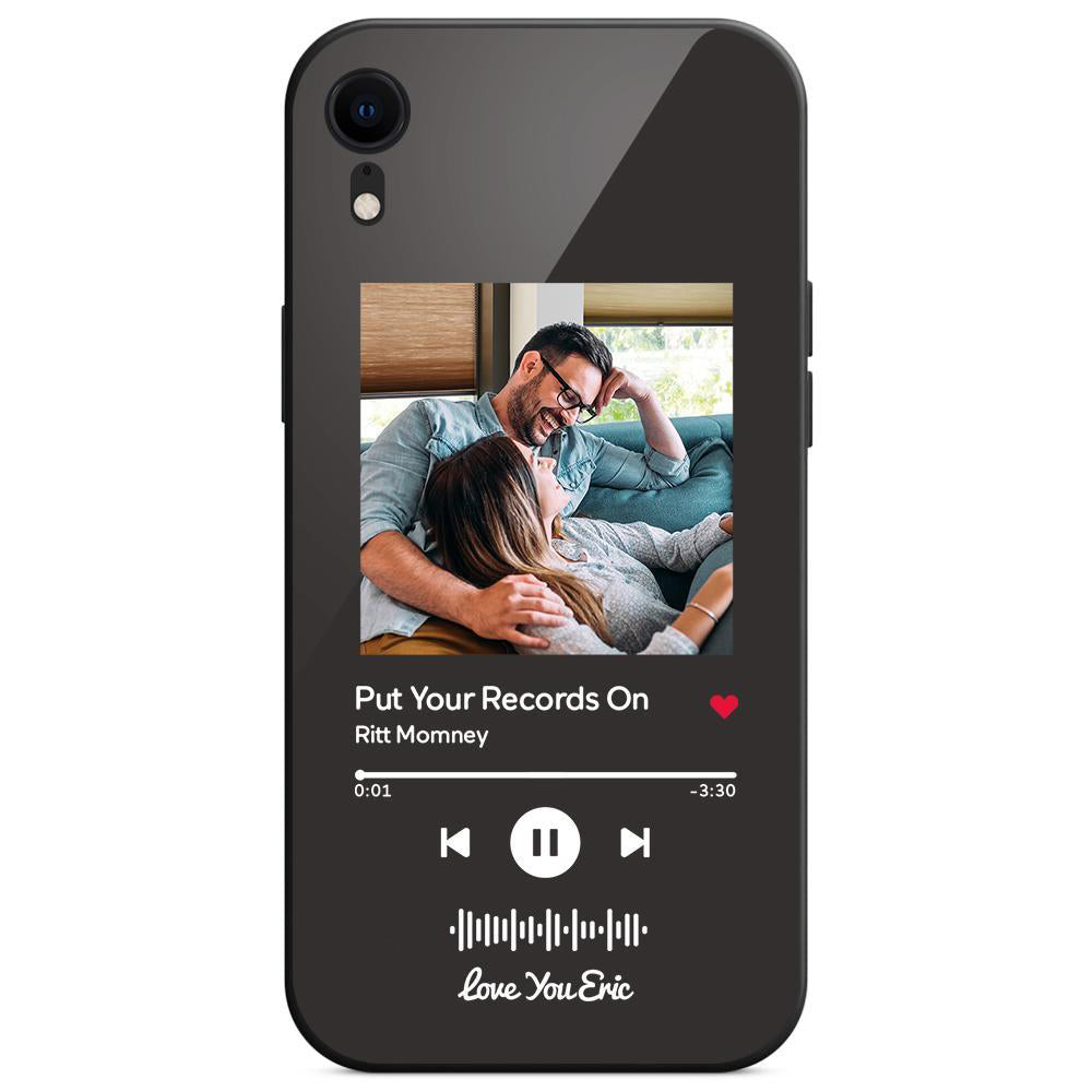 Phone case with music app design and a photo of a couple on a sofa.