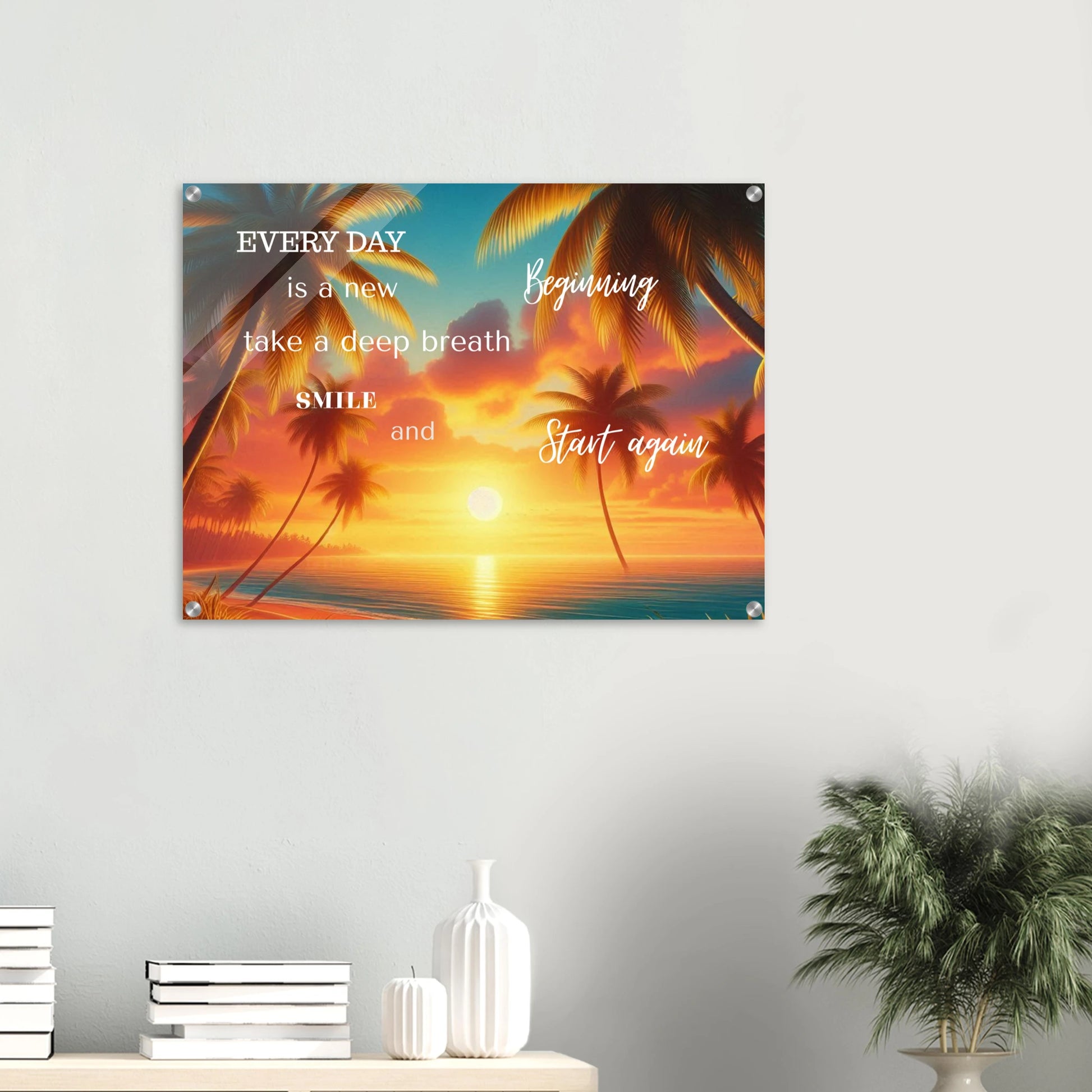 Wall art with palm trees and motivational quote against a sunset background, displayed on a wall.