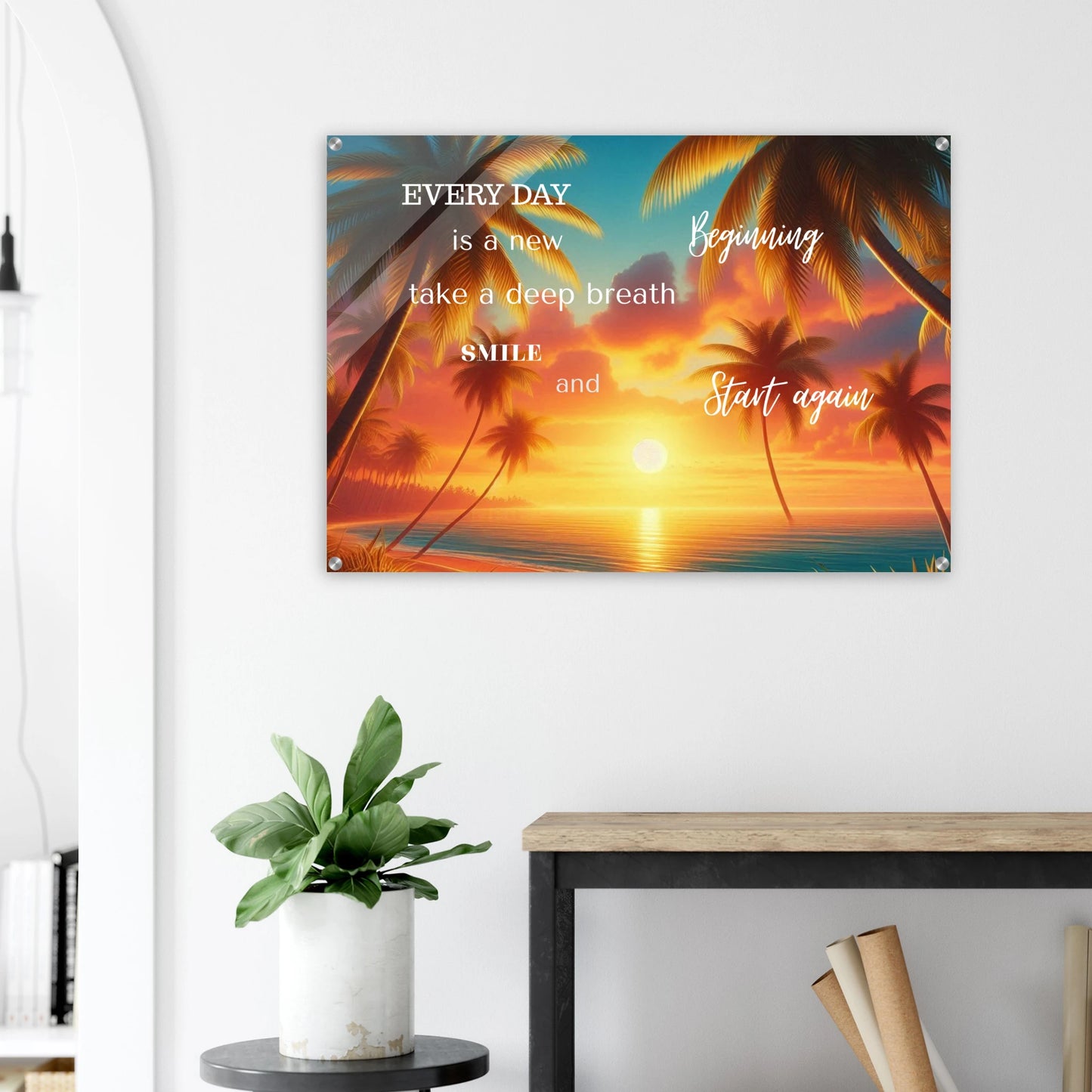 Decorative wall poster with motivational quote and sunset design in a home setting.