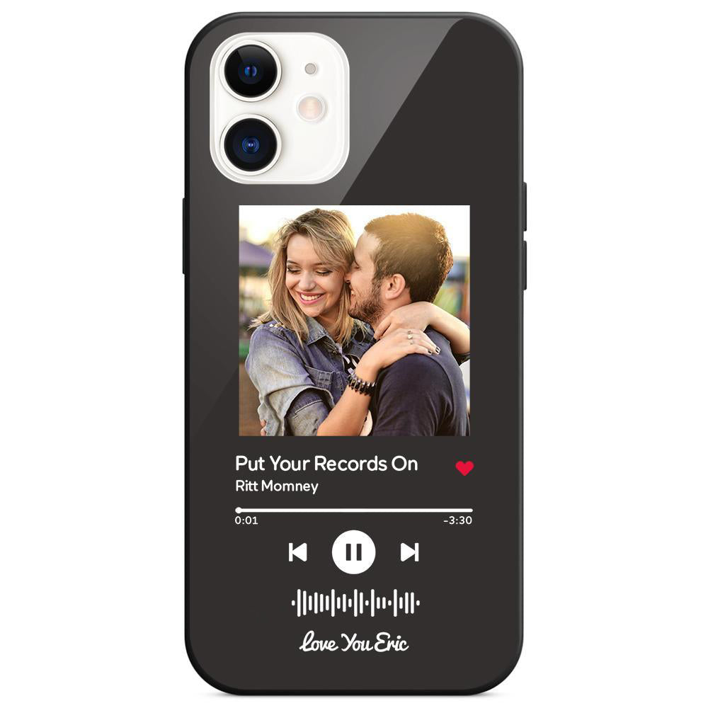 Phone case featuring a photo of a couple and a music player interface with the song "Put Your Records On" by Ritt Momney.