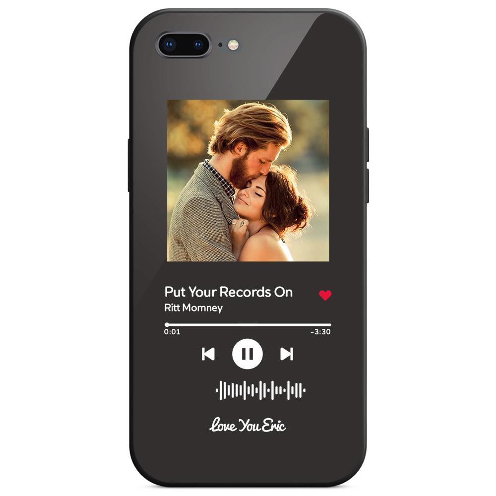 Black smartphone case with music app. Couple embrace on screen.