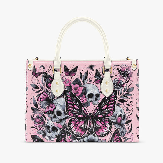 Handbag with pink background, black and white butterfly design, and skulls on a white background