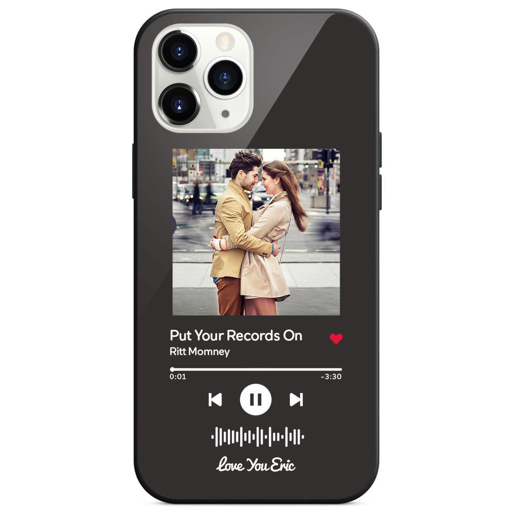 Black phone case with image of couple embracing and music app display.