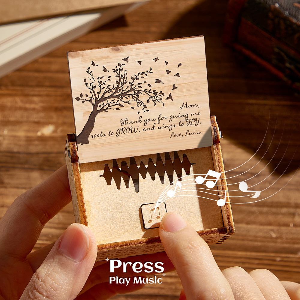 Personalized wooden music box with tree design, plays custom audio, a unique Mother's Day gift. Press to play music.