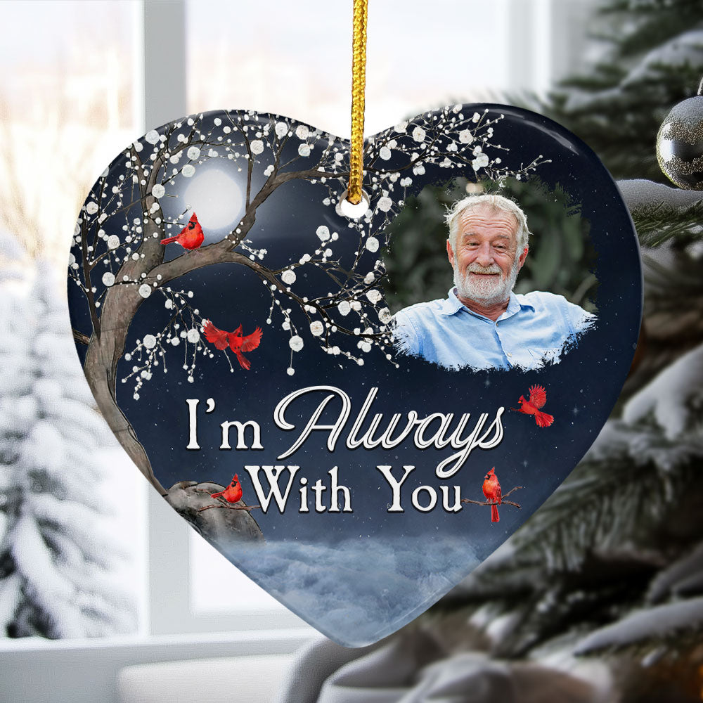 Heart-shaped ceramic Christmas ornament with snowy night scene, red cardinals, personalized photo, and white script text on.