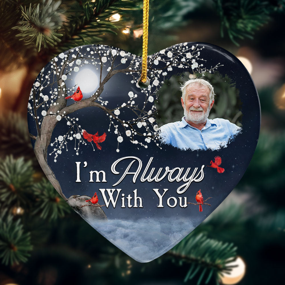Heart-shaped ceramic Christmas ornament with snowy tree and red cardinals design, personalized with photo and "I'm Always.