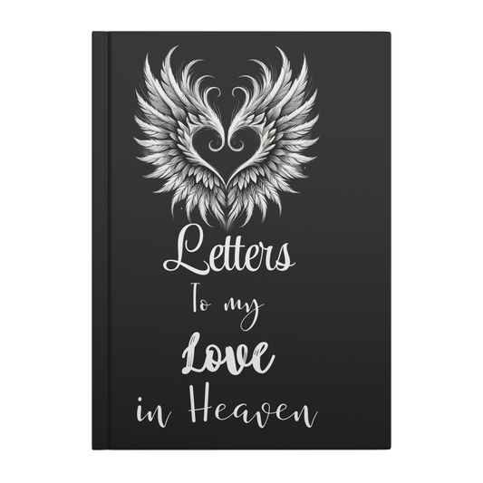 Black hardcover journal with white angel wings forming a heart and "Letters To my Love in Heaven" text on cover.