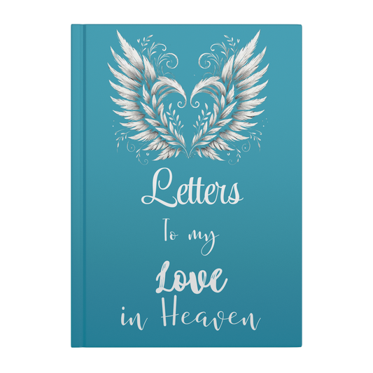 Teal hardcover notebook with silver angel wings forming a heart and white script text "Letters to my Love in Heaven".
