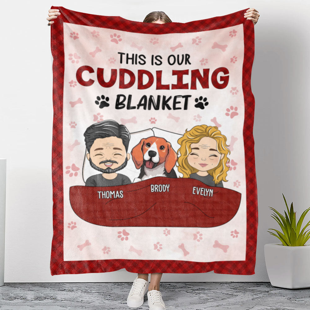 Personalized fleece blanket with cartoon couple and dog in red pocket, heart and paw print pattern.