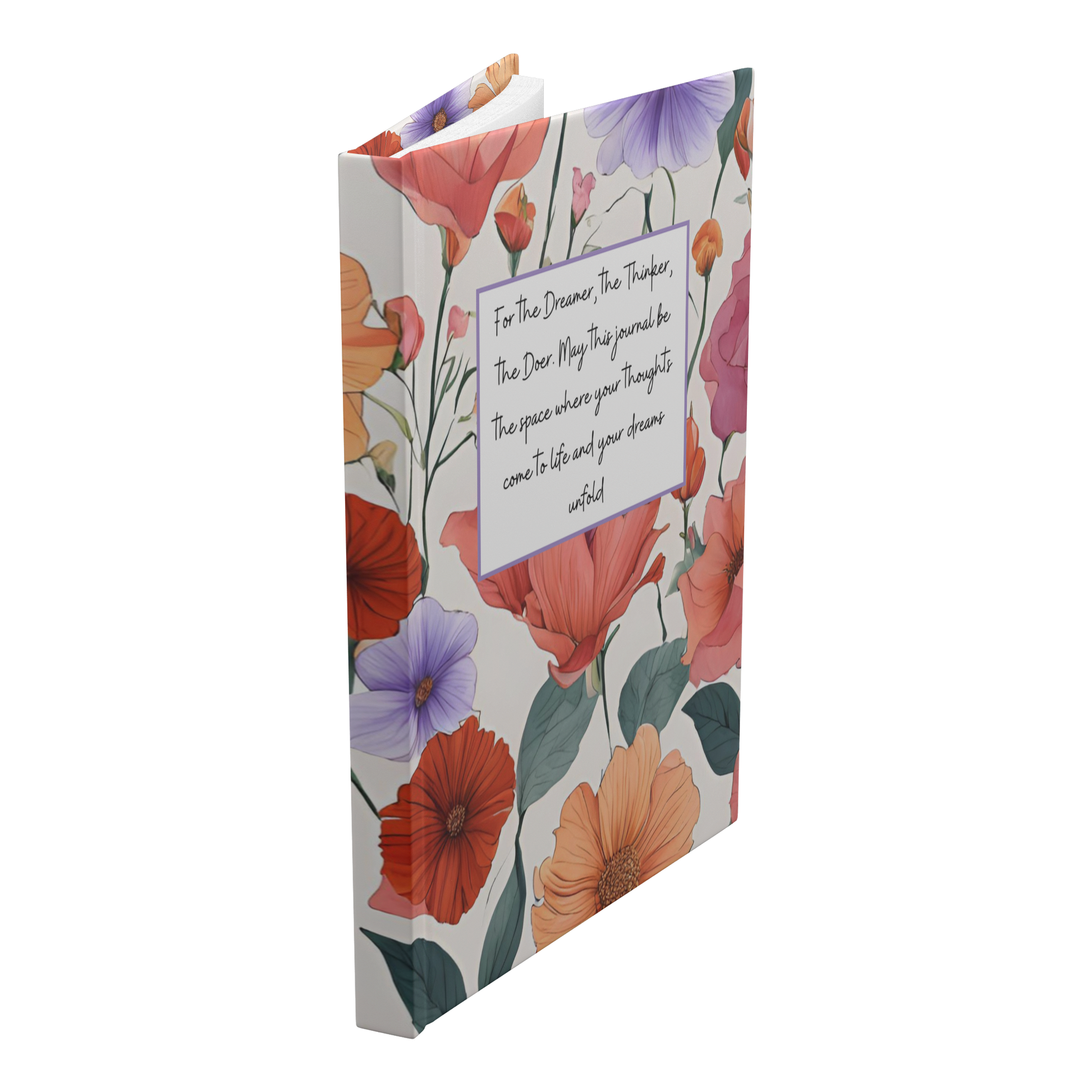 Notebook with colorful floral cover and inspirational quote in white box on front.