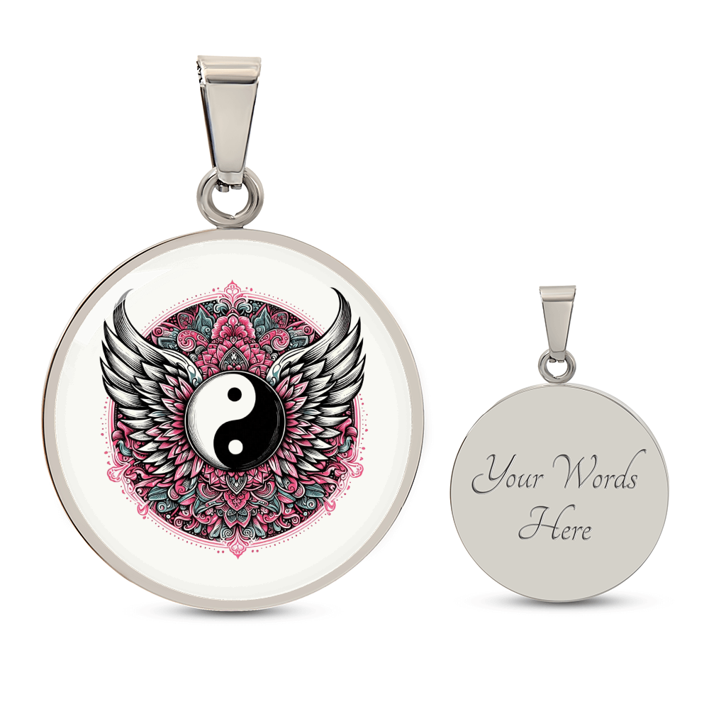 Round silver necklace pendant featuring black and white yin yang symbol with detailed angel wings and pink floral mandala.