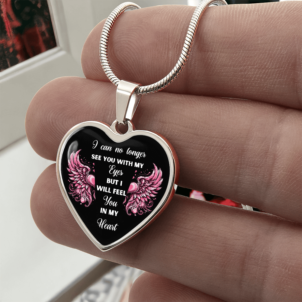 Silver heart-shaped pendant necklace with engraved sympathy message and pink floral accents.