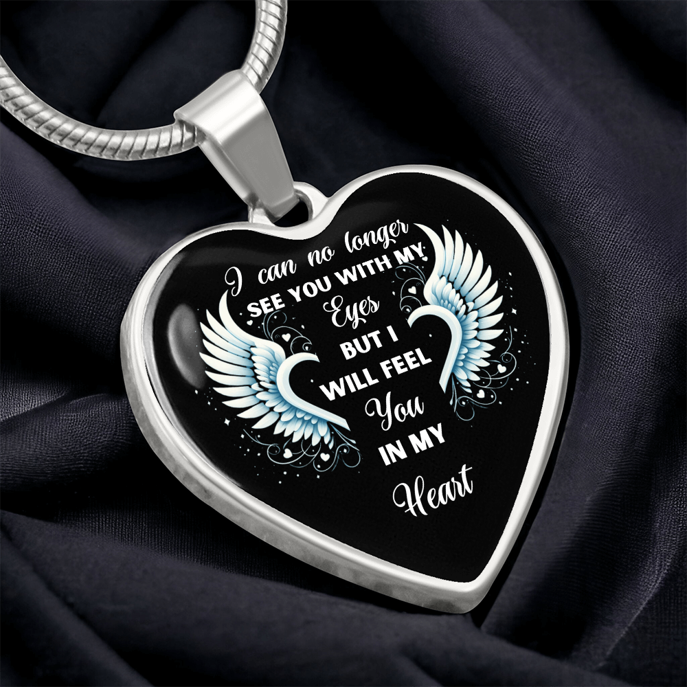 Heart-shaped necklace with angel wings and "I can no longer see you with my eyes but I will feel you in my heart" text.