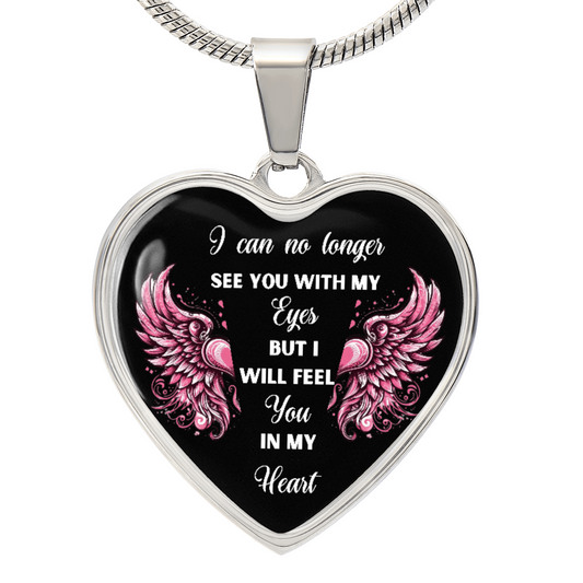Silver heart-shaped pendant necklace with black background, pink angel wings, and white sentimental text.