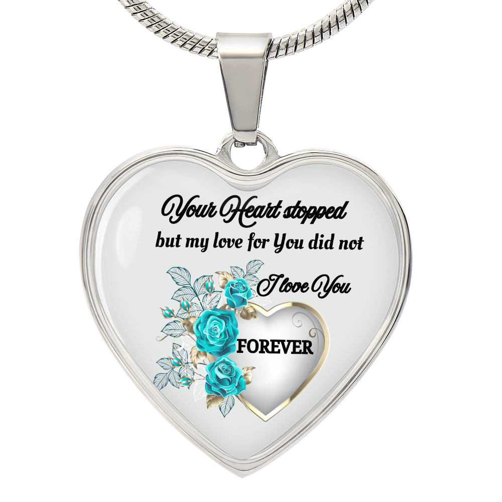 Silver heart-shaped pendant necklace with blue roses and sentimental quote engraving.