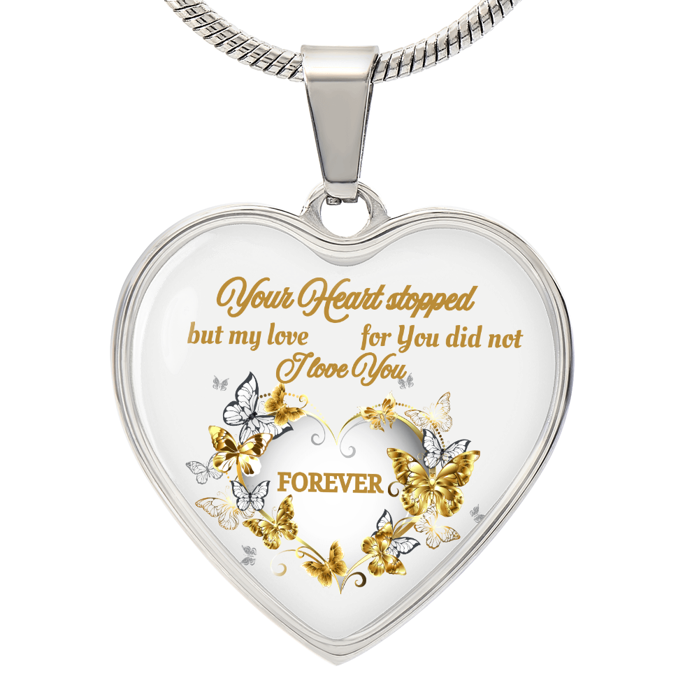 Silver heart pendant necklace with gold and silver butterflies and engraved sentimental text.