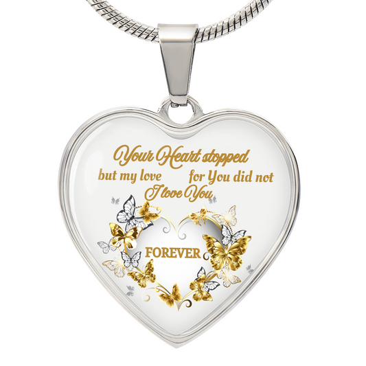 Silver heart pendant necklace with gold and silver butterflies and engraved sentimental text.