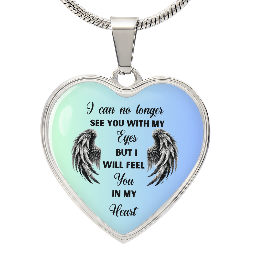 Heart-shaped pendant with "I can no longer see you with my eyes" text and angel wings.
