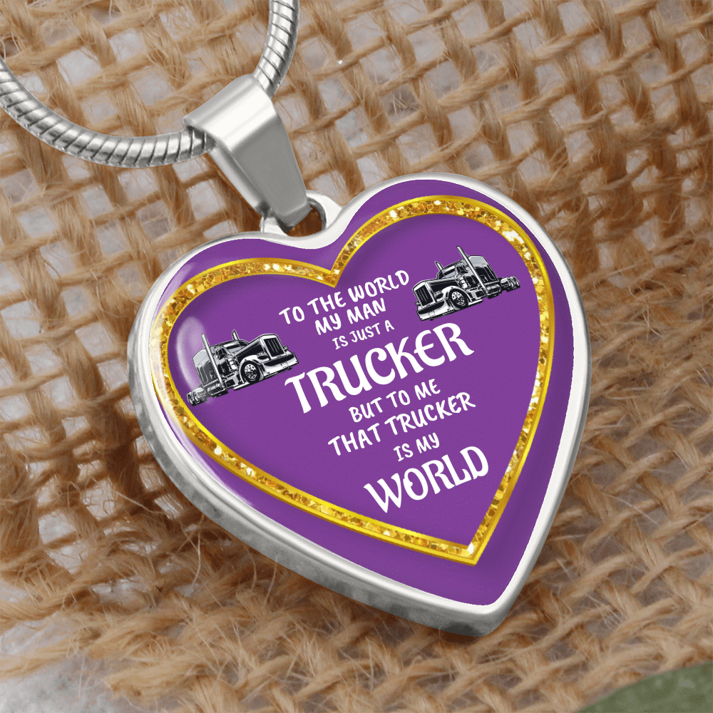 Heart-shaped necklace with "Trucker" text, silver trim, purple background, and truck images.