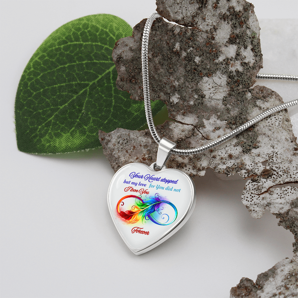 Silver heart pendant necklace with colorful infinity symbol and sentimental memorial inscription.
