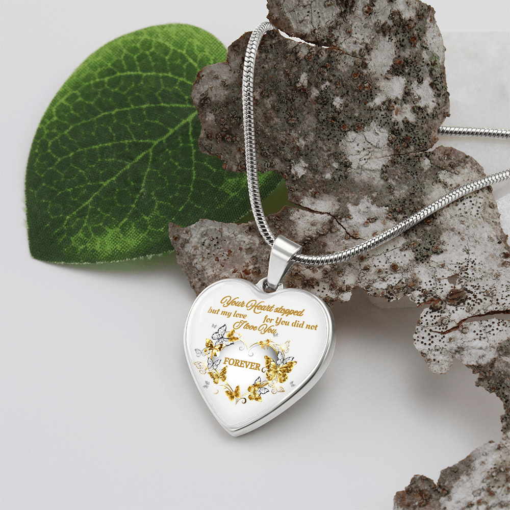 Silver heart pendant necklace with engraved romantic message and floral design on snake chain.