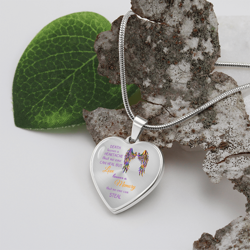 Heart-shaped pendant necklace with angel wings and memorial quote.