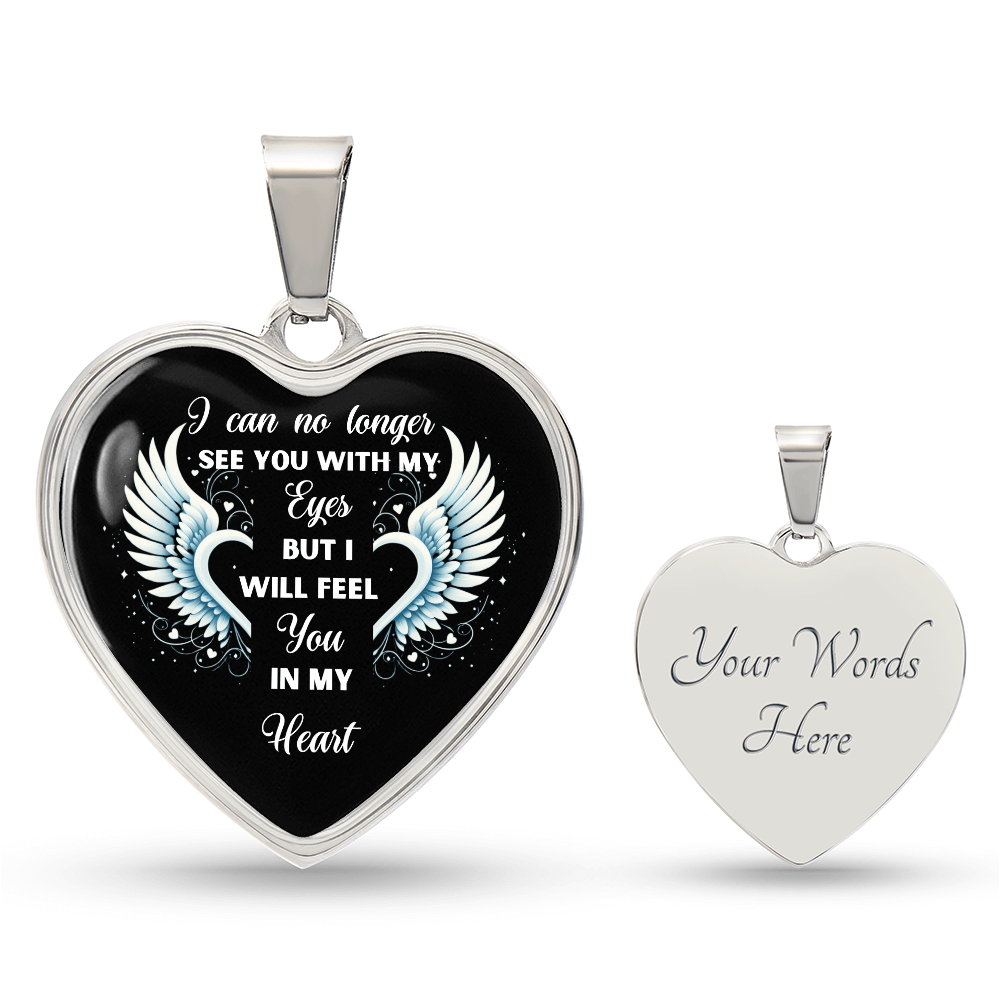 Silver heart-shaped pendant necklace with black center, engraved angel wings and the quote "I can no longer see you with my.