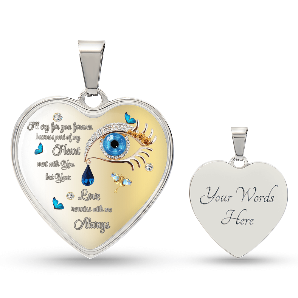 Silver heart-shaped pendant with a blue eye design, text, and butterfly embellishments, alongside a similar pendant with the text "Your Words Here".