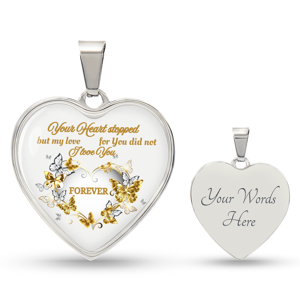 Silver heart pendant necklace engraved with gold floral design and heartfelt memorial message on front, plain polished back.