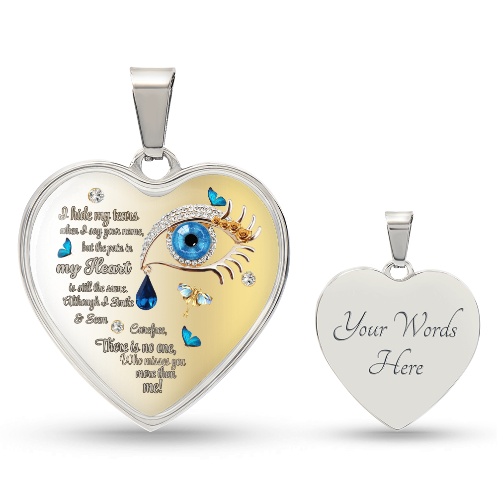 Silver heart-shaped pendant necklace with blue eye and butterfly graphic, engraved text on front, customizable back engraving.