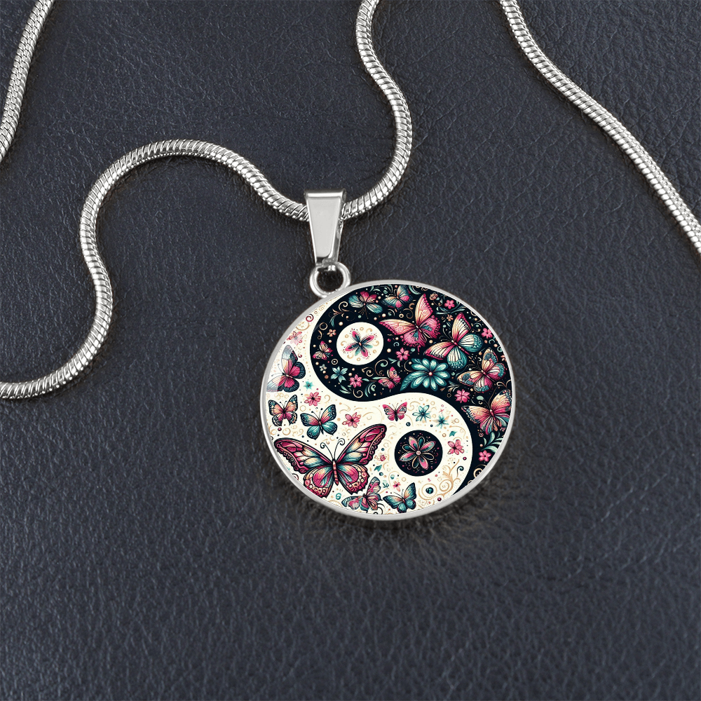 Silver yin-yang pendant necklace with butterflies and flowers.