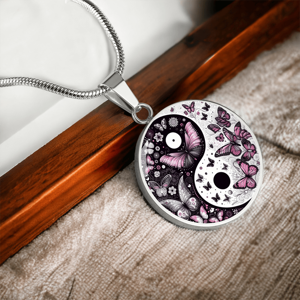 Silver round yin yang pendant with violet butterflies on silver snake chain necklace.