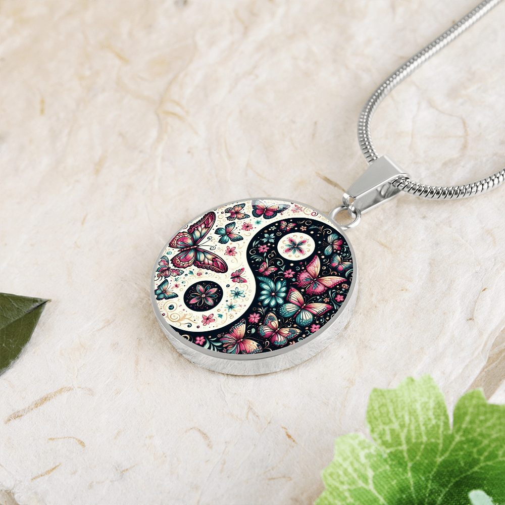 Yin Yang pendant necklace with butterflies and flowers.
