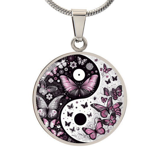 Silver circular pendant necklace featuring a yin yang design with pink and violet butterflies and floral accents.