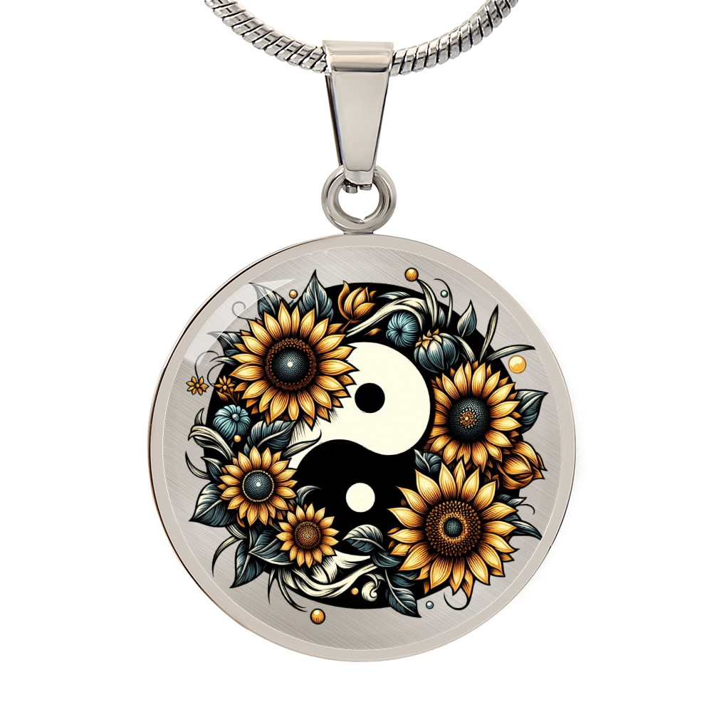 Silver circle necklace pendant with yin yang symbol surrounded by detailed golden sunflowers and leaves.