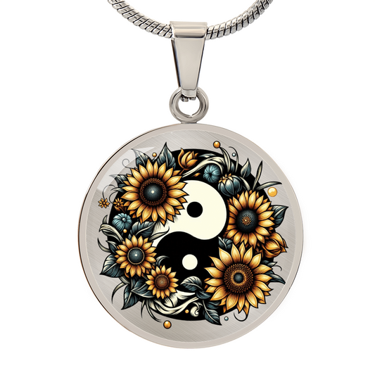 Silver circle necklace pendant with yin yang symbol surrounded by detailed golden sunflowers and leaves.