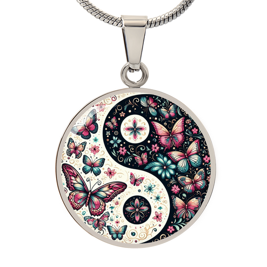 Yin yang pendant necklace with butterflies and floral design.