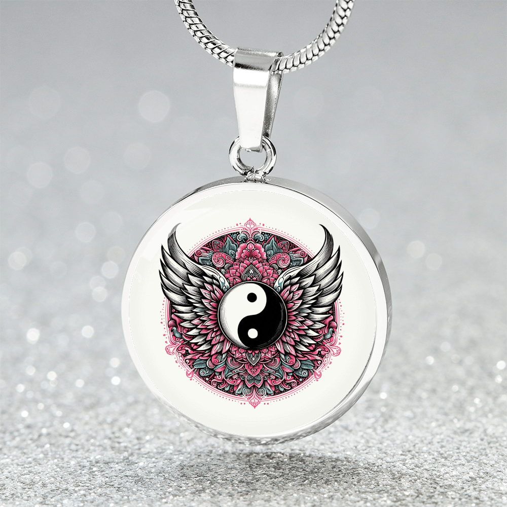 Silver circle pendant necklace with yin yang symbol, detailed angel wings, and pink floral mandala design.