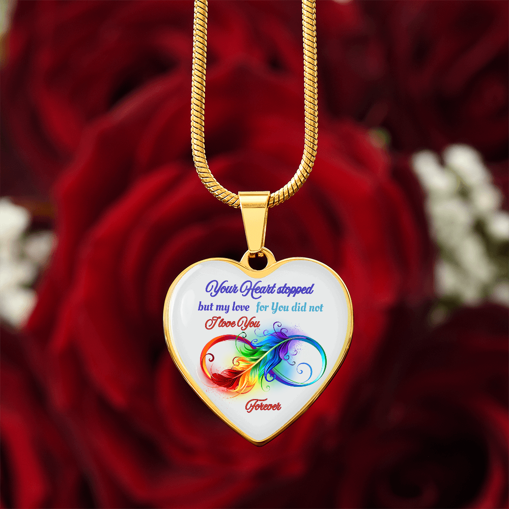 Gold heart pendant necklace with colorful infinity design and blue script memorial message.