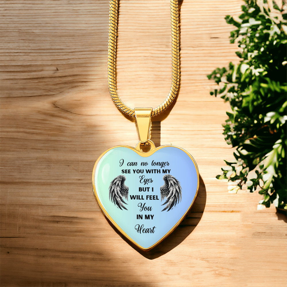 Gold heart-shaped pendant necklace with black angel wings and sentimental engraved text.