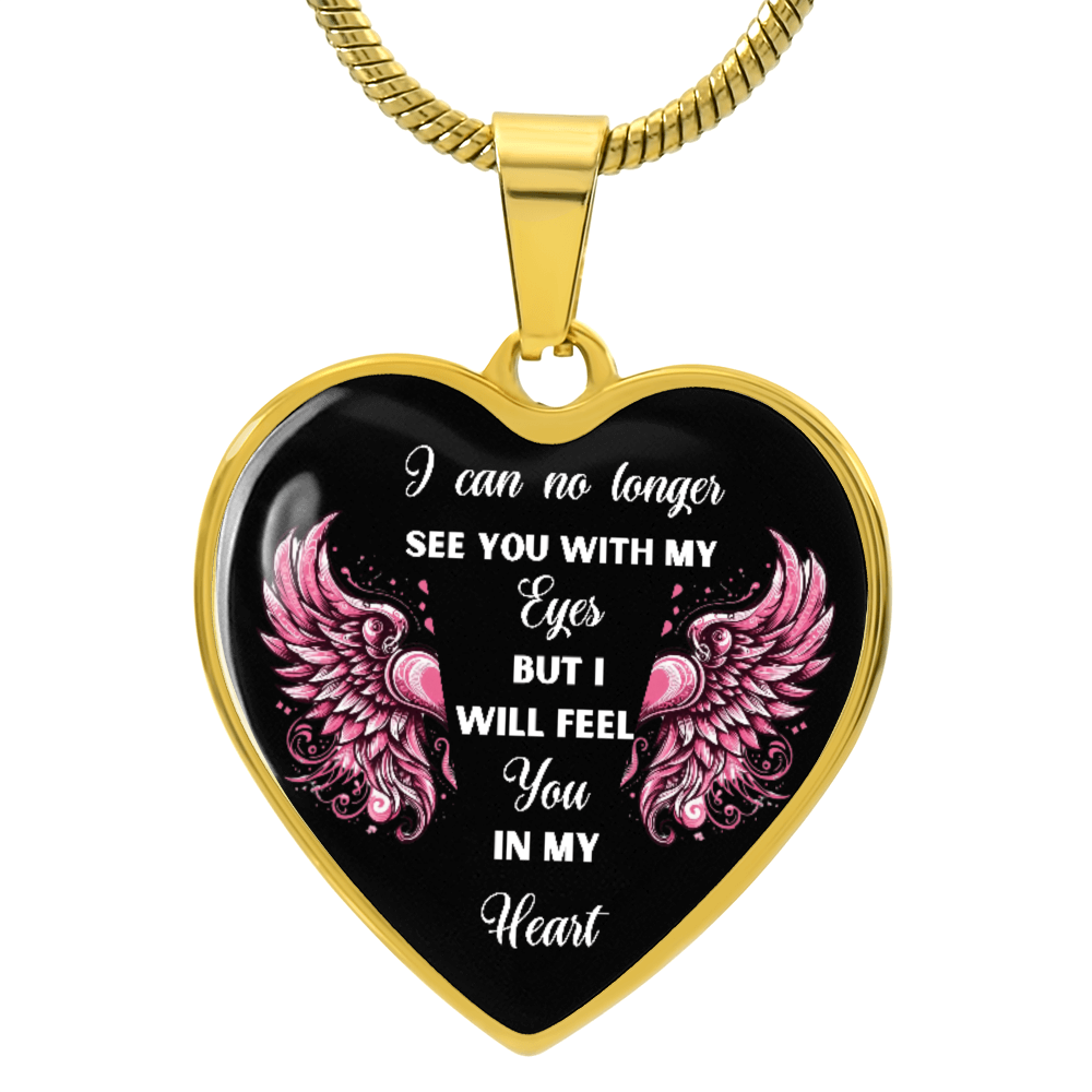 Gold heart-shaped pendant necklace with black background and pink angel wings, sentimental white script text.
