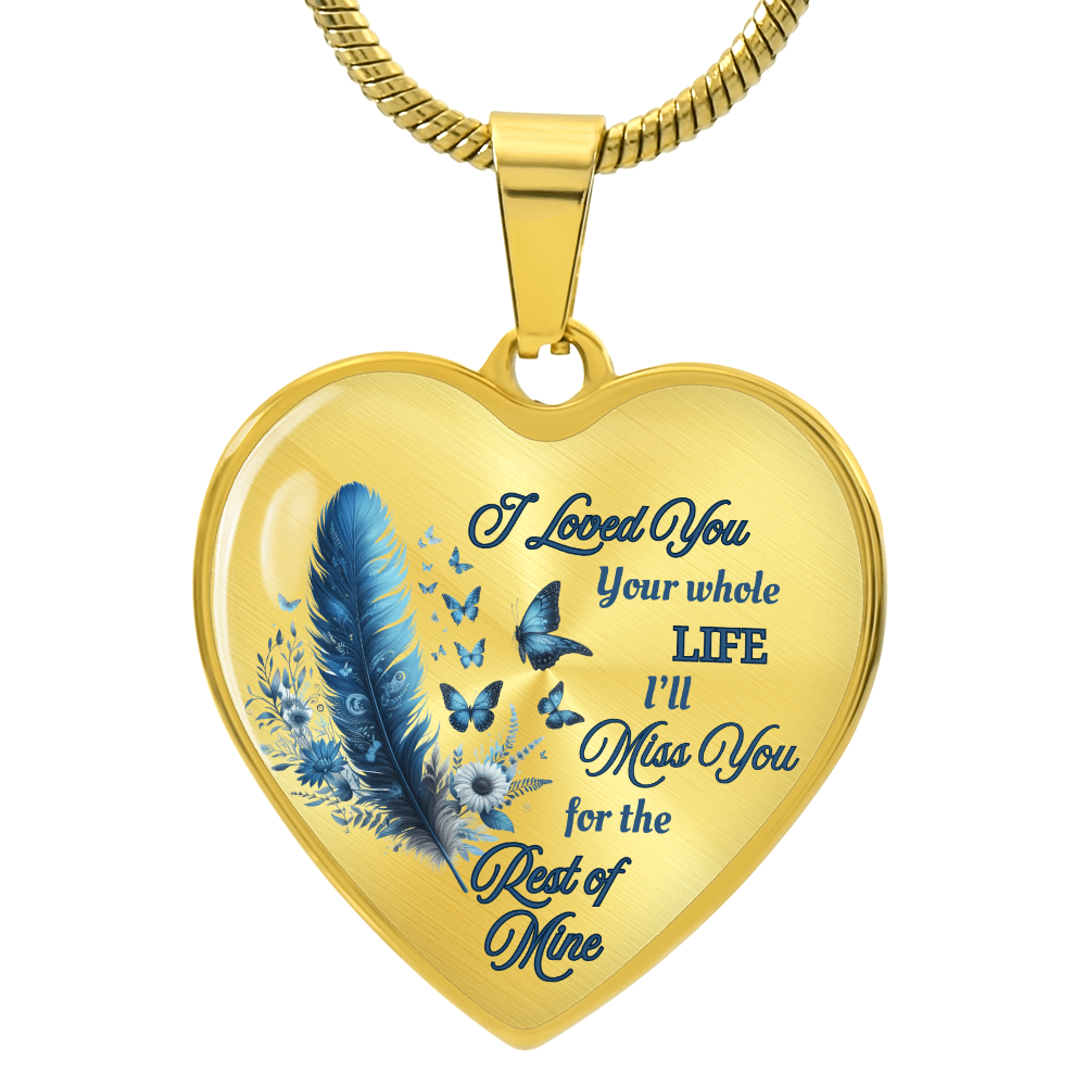 Gold heart-shaped pendant necklace with blue feather and engraved sentimental message.