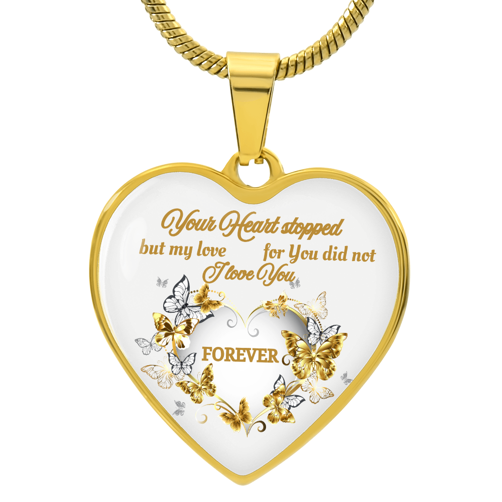 Gold heart pendant necklace with engraved butterfly design and sentimental memorial message.
