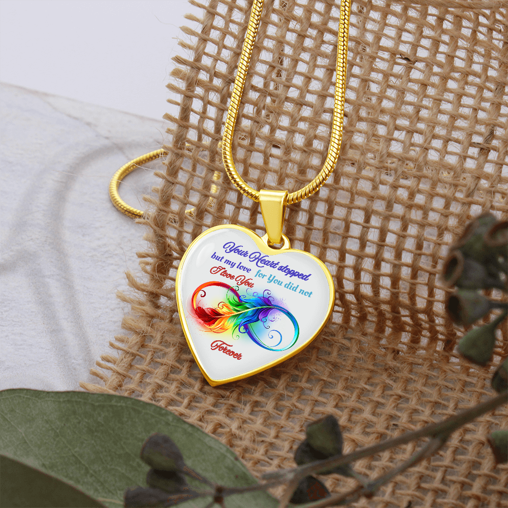 Gold heart-shaped pendant necklace with colorful infinity design and sentimental text on white background.