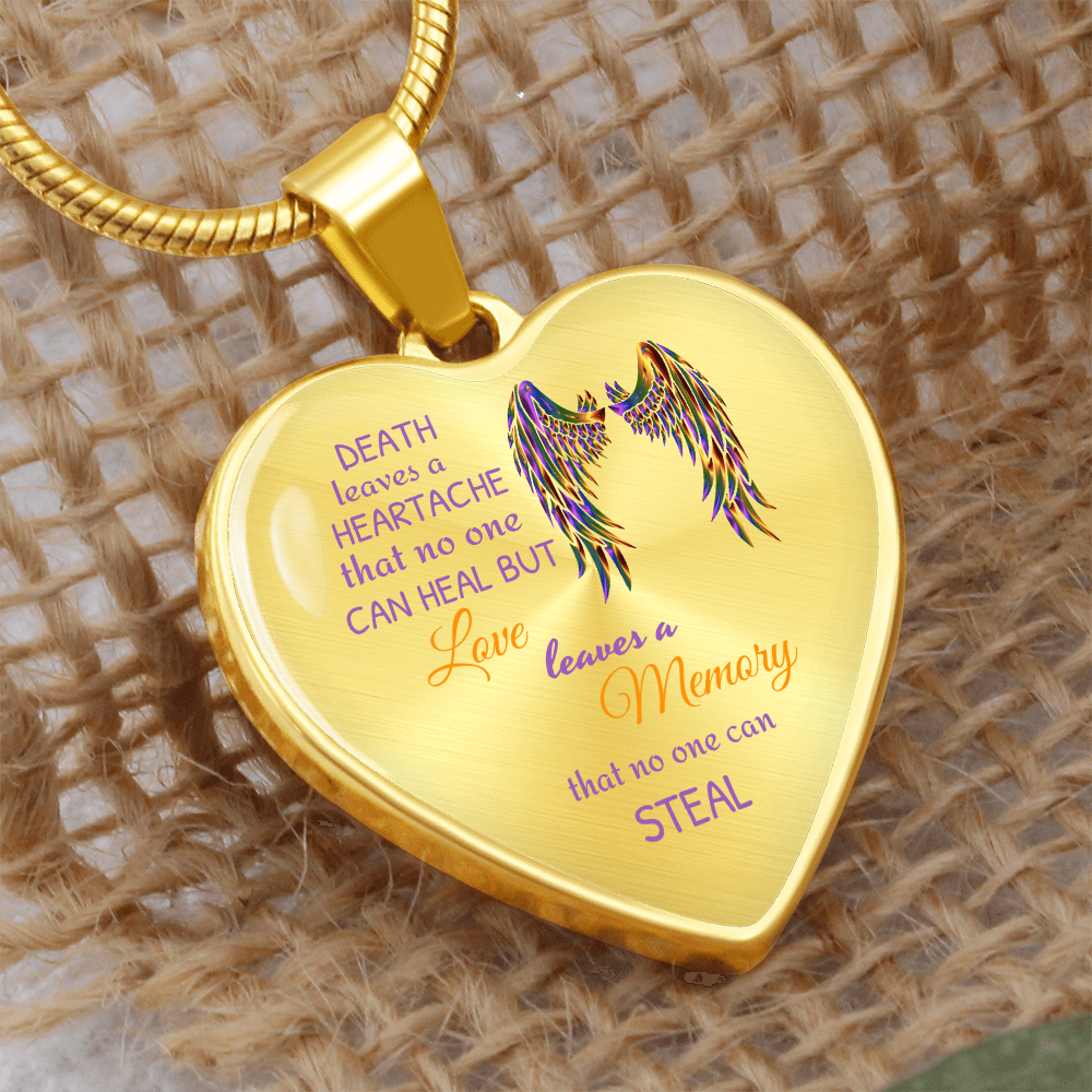Gold heart-shaped pendant with colorful angel wings and a bereavement quote on a gold snake chain.
